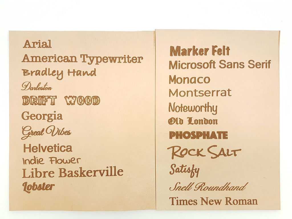 Personalized leather valet tray featuring various font samples on smooth leather surface.