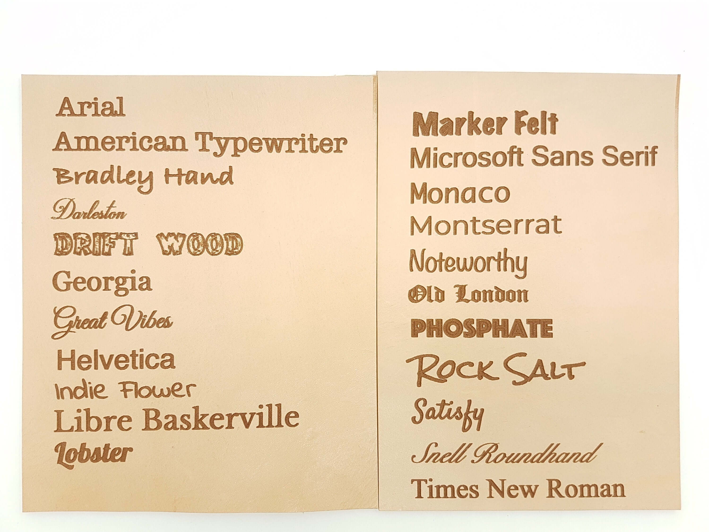 Personalized leather valet tray featuring various font samples on smooth leather surface.