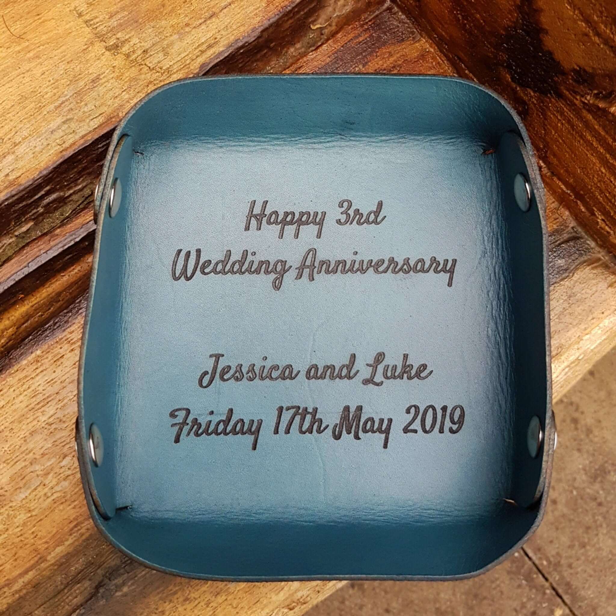 Personalized leather valet tray engraved for Jessica and Luke's 3rd Wedding Anniversary, dated May 17, 2019.