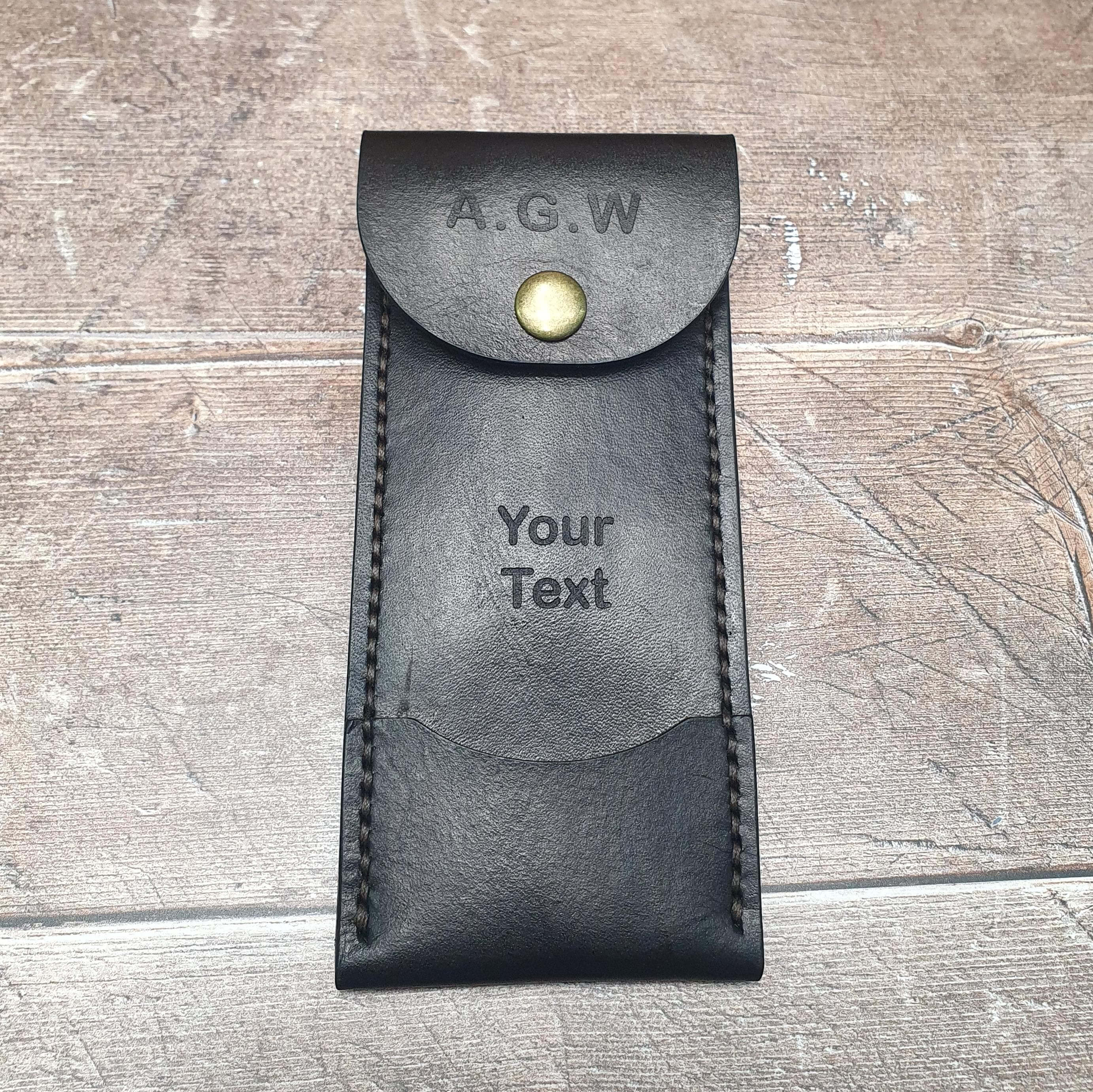 Personalized leather darts case with customized text and snap closure for dart players.