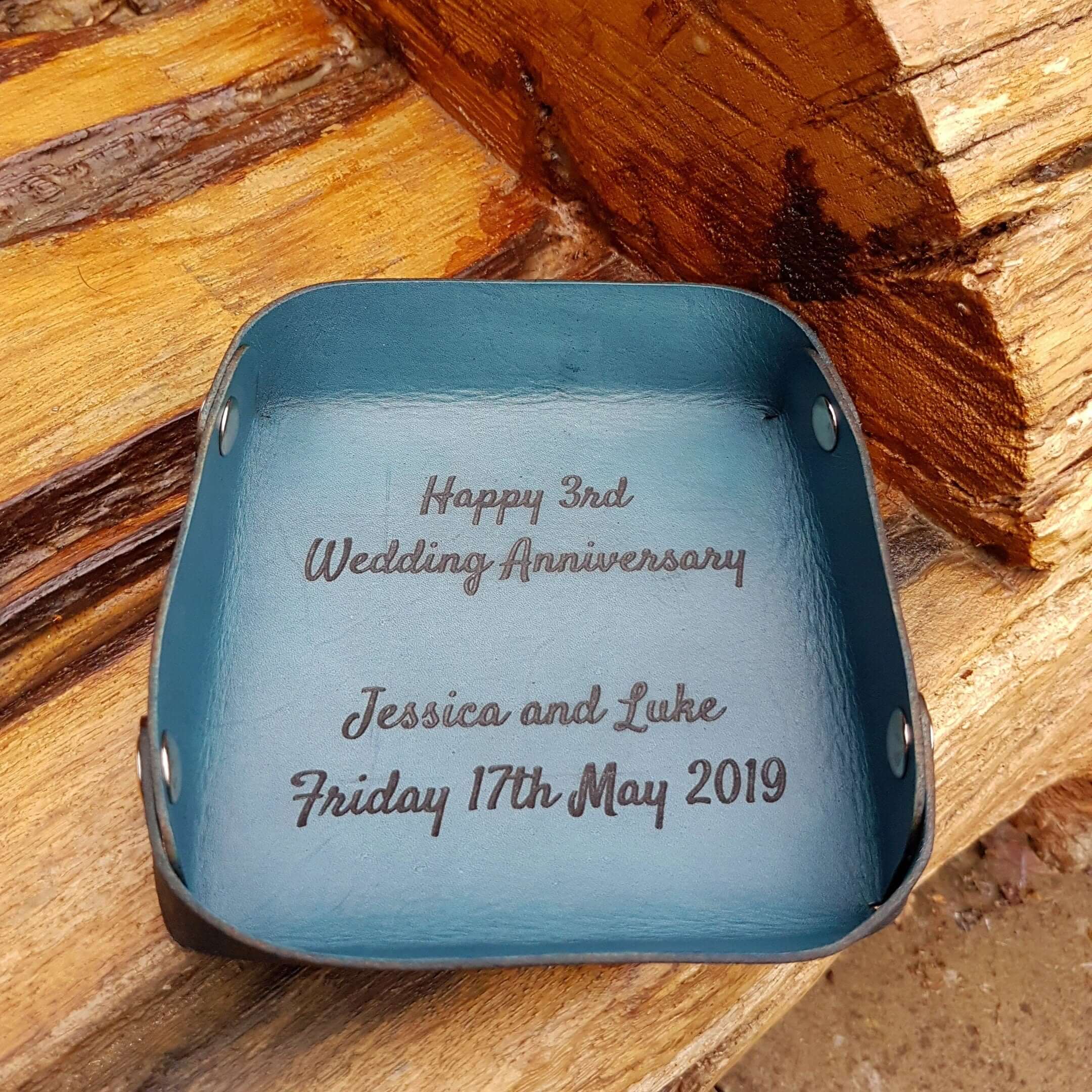 Personalized leather valet tray with engraved wedding anniversary message for Jessica and Luke.